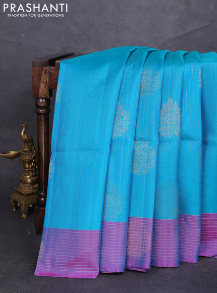 Pure soft silk saree teal blue and dual shade of bluish pink with allover zari strieps & buttas and zari woven checked border