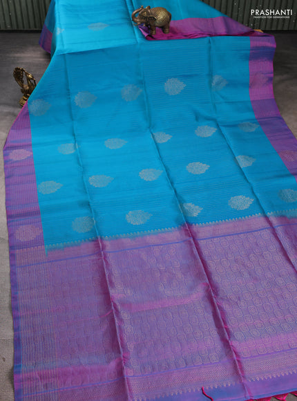 Pure soft silk saree teal blue and dual shade of bluish pink with allover zari strieps & buttas and zari woven checked border