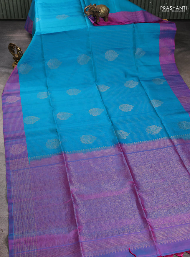 Pure soft silk saree teal blue and dual shade of bluish pink with allover zari strieps & buttas and zari woven checked border