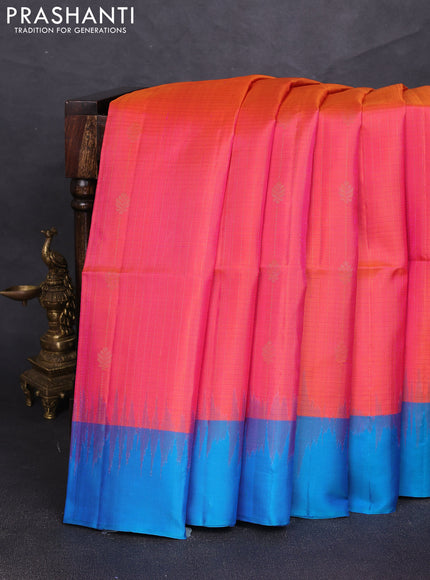 Pure soft silk saree dual shade of pinkish orange and cs blue with allover zari weaves & buttas and simple border