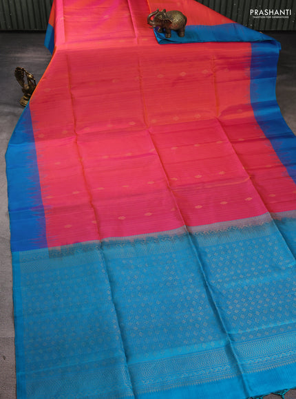 Pure soft silk saree dual shade of pinkish orange and cs blue with allover zari weaves & buttas and simple border