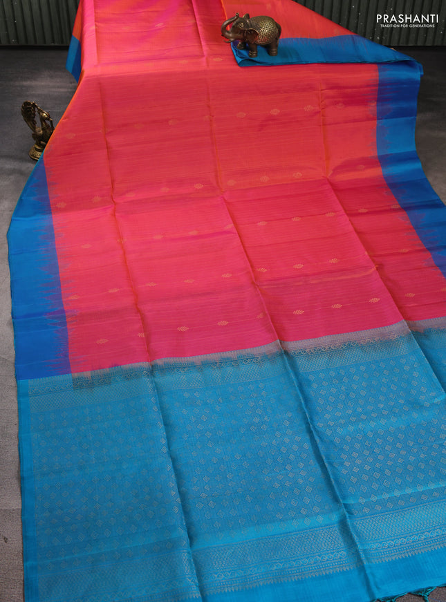Pure soft silk saree dual shade of pinkish orange and cs blue with allover zari weaves & buttas and simple border