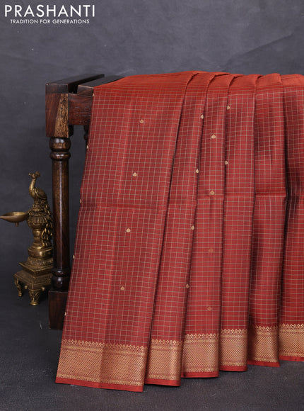 Pure soft silk saree rust shade with allover zari checks & buttas and zari woven border