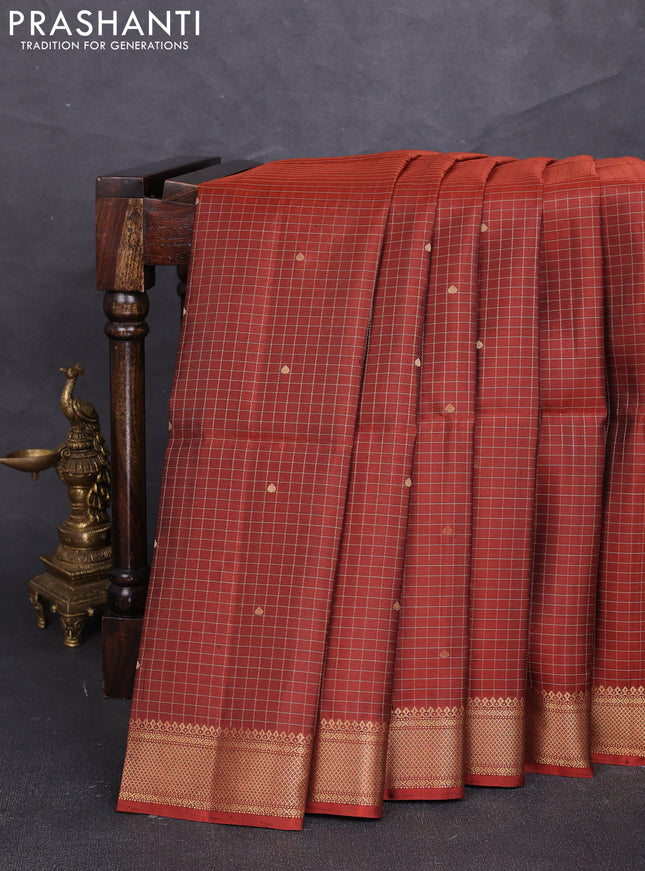 Pure soft silk saree rust shade with allover zari checks & buttas and zari woven border