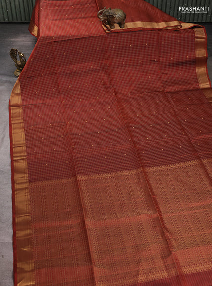 Pure soft silk saree rust shade with allover zari checks & buttas and zari woven border