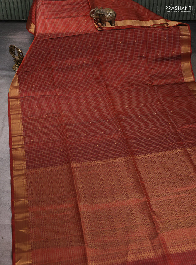 Pure soft silk saree rust shade with allover zari checks & buttas and zari woven border