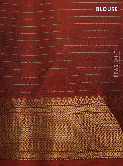 Pure soft silk saree rust shade with allover zari checks & buttas and zari woven border