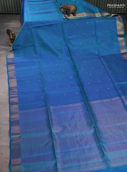 Pure soft silk saree dual shade of bluish green with allover zari checks & buttas and zari woven border