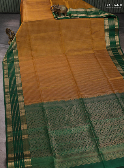 Pure soft silk saree mustard yellow and green with allover laksha deepam pattern and zari woven border