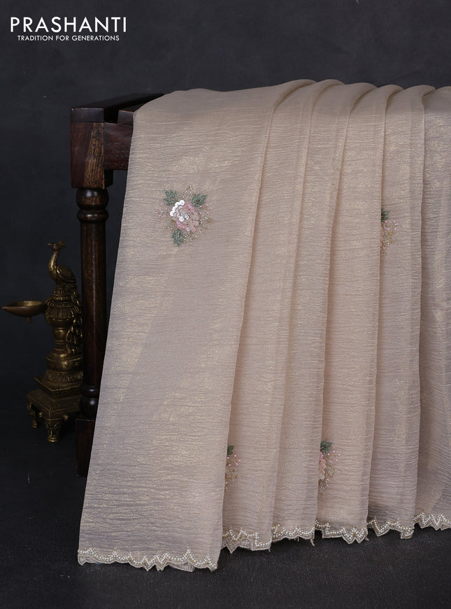 Crush tissue saree cream with floral sequin embroidery buttas and beaded work border