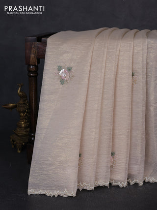 Crush tissue saree cream with floral sequin embroidery buttas and beaded work border