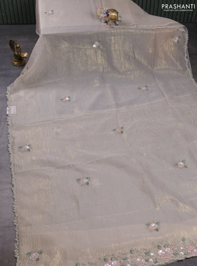 Crush tissue saree cream with floral sequin embroidery buttas and beaded work border