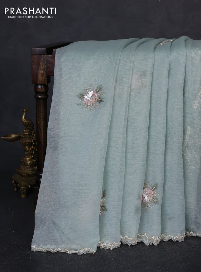 Crush tissue saree teal blue with floral sequin embroidery buttas and beaded work border
