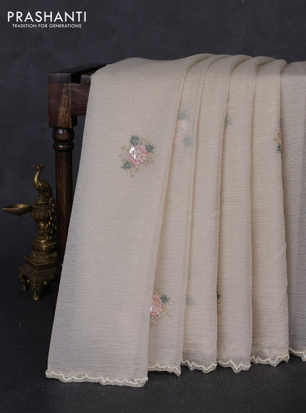 Crush tissue saree beige with floral sequin embroidery buttas and beaded work border