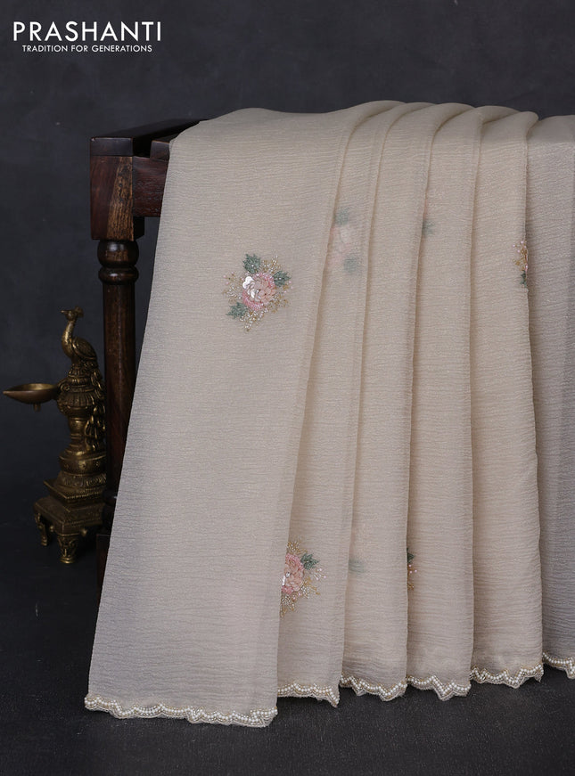 Crush tissue saree beige with floral sequin embroidery buttas and beaded work border