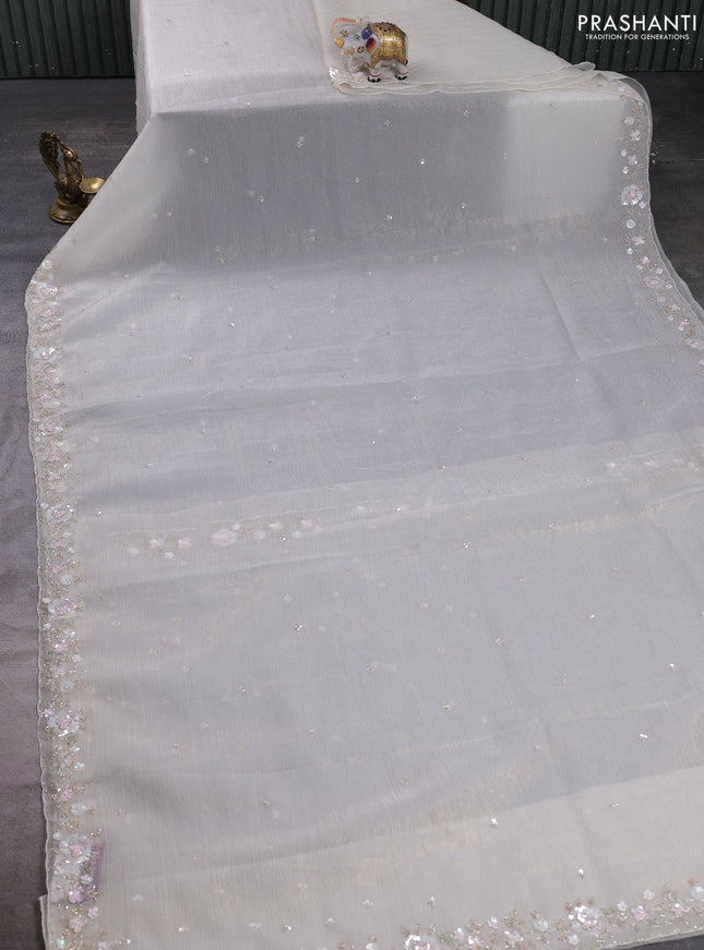 Crush tissue saree cream with sequin embroidery buttas and floral sequin embroidery pallu & border