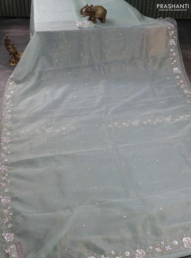 Crush tissue saree pastel green with sequin embroidery buttas and floral sequin embroidery pallu & border