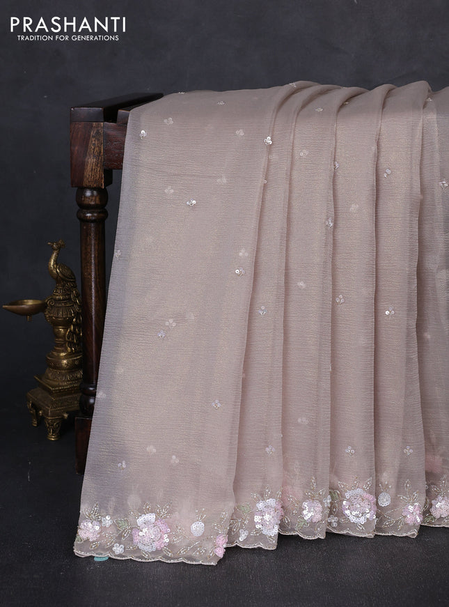 Crush tissue saree beige with sequin embroidery buttas and floral sequin embroidery pallu & border