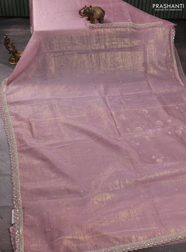 Crush tissue saree pastel pink with beaded work buttas and sequin embroidery pallu & border