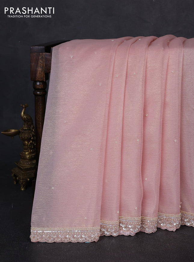 Crush tissue saree mild peach with beaded work buttas and sequin embroidery pallu & border