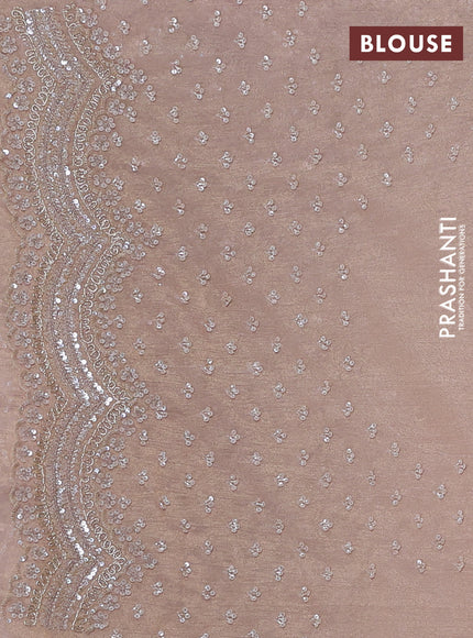 Crush tissue saree pastel peach with sequin embroidery buttas and sequin embroidery pallu & border