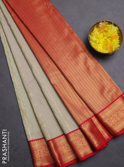 Semi kanchipuram silk saree pista green and red with allover zari stripe & buttas and zari woven border