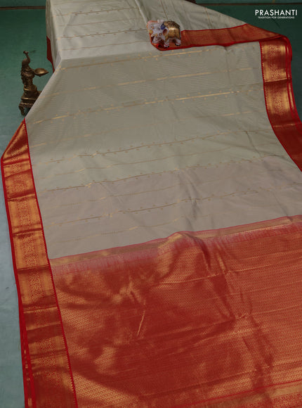 Semi kanchipuram silk saree pista green and red with allover zari stripe & buttas and zari woven border