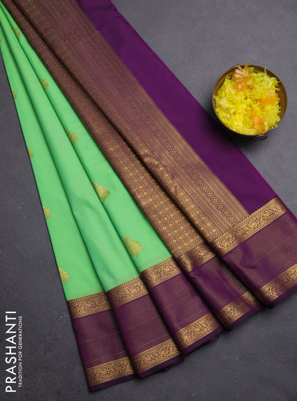 Semi kanchipuram silk saree dual shade of teal green and purple with zari woven buttas and zari woven border