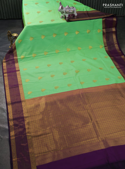 Semi kanchipuram silk saree dual shade of teal green and purple with zari woven buttas and zari woven border