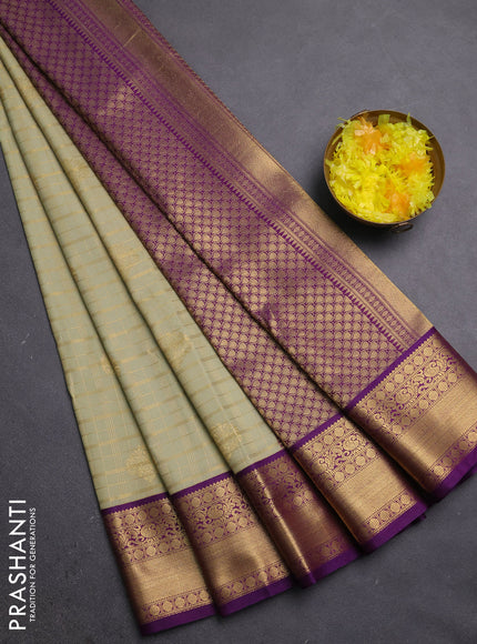 Semi kanchipuram silk saree mild pista green and purple with allover zari checks & buttas and zari woven korvai border