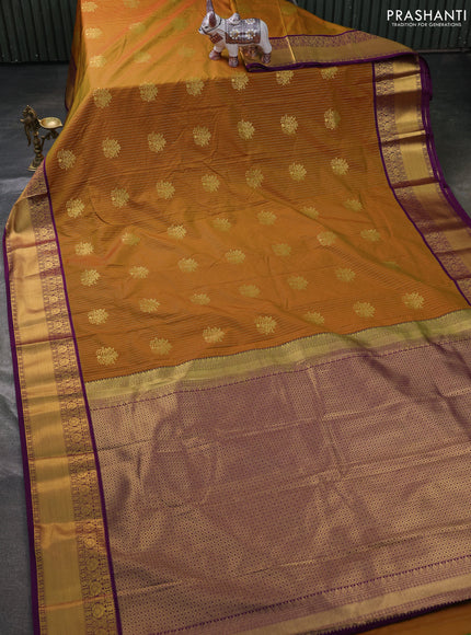 Semi kanchipuram silk saree dark mustard and purple with allover zari weaves & buttas and zari woven border
