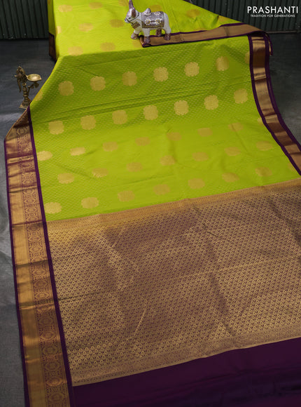 Semi kanchipuram silk saree lime green and purple with allover zari weaves & buttas and zari woven korvai border