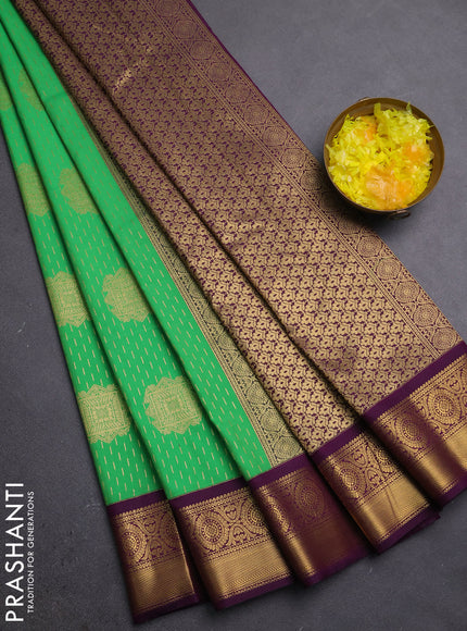 Semi kanchipuram silk saree light green and purple with allover zari weaves & buttas and zari woven korvai border