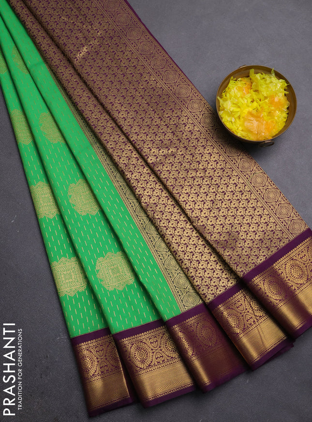 Semi kanchipuram silk saree light green and purple with allover zari weaves & buttas and zari woven korvai border