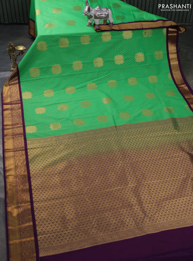 Semi kanchipuram silk saree light green and purple with allover zari weaves & buttas and zari woven korvai border