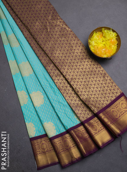 Semi kanchipuram silk saree teal blue and purple with allover zari weaves & buttas and zari woven korvai border