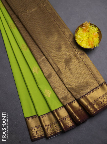 Semi kanchipuram silk saree light green and coffee brown with zari woven buttas and zari woven korvai border