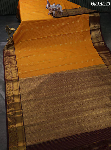 Semi kanchipuram silk saree mustard yellow and coffee brown with allover zari weaves & buttas and zari woven korvai border