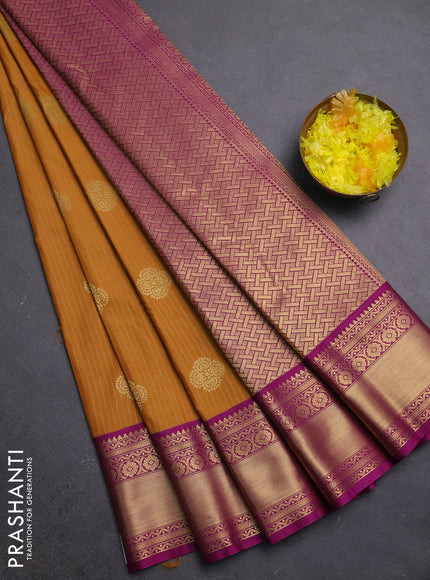 Semi kanchipuram silk saree dark mustard and pink with allover zari weaves & buttas and zari woven korvai border