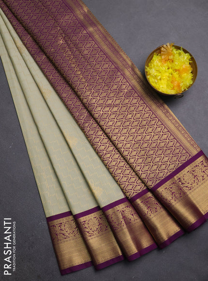 Semi kanchipuram silk saree mild pista green and purple with allover zari weaves & buttas and zari woven korvai border