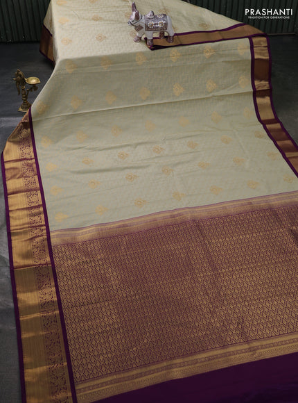 Semi kanchipuram silk saree mild pista green and purple with allover zari weaves & buttas and zari woven korvai border