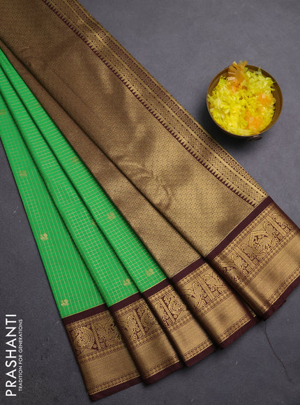Semi kanchipuram silk saree light green and coffee brown with allover small zari checks & buttas and zari woven korvai border