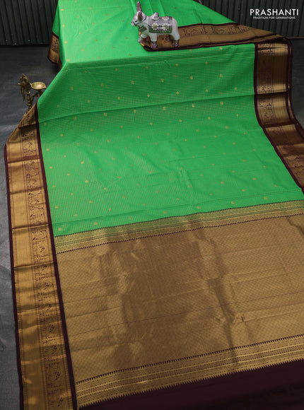 Semi kanchipuram silk saree light green and coffee brown with allover small zari checks & buttas and zari woven korvai border