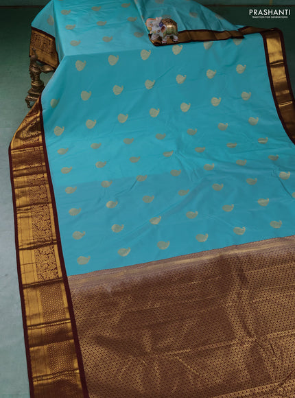 Semi kanchipuram silk saree teal green and coffee brown with zari woven buttas and zari woven border