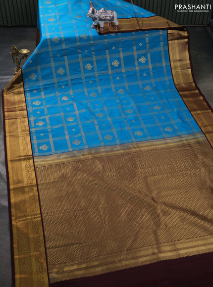 Semi kanchipuram silk saree peacock blue and coffee brown with allover zari checks & buttas and zari woven border