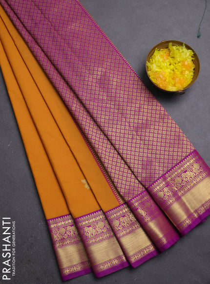 Semi kanchipuram silk saree dark mustard and pink with zari woven buttas and zari woven border