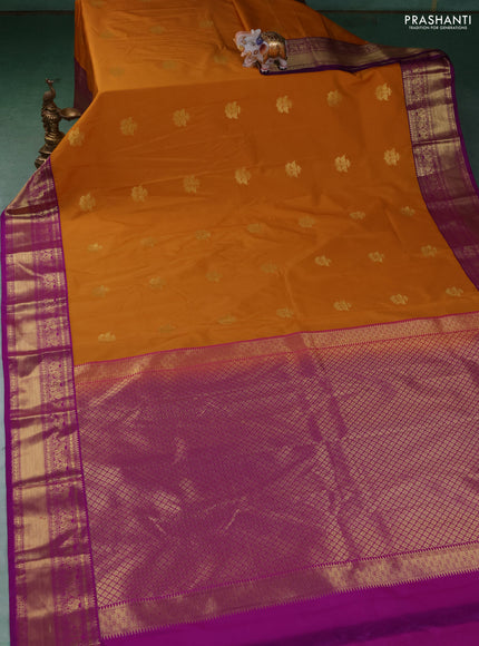 Semi kanchipuram silk saree dark mustard and pink with zari woven buttas and zari woven border