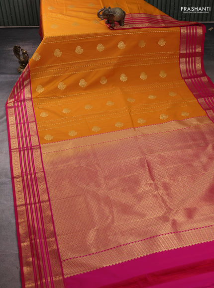 Semi kanchipuram silk saree mustard yellow and pink with allover zari weaves & buttas and zari woven border