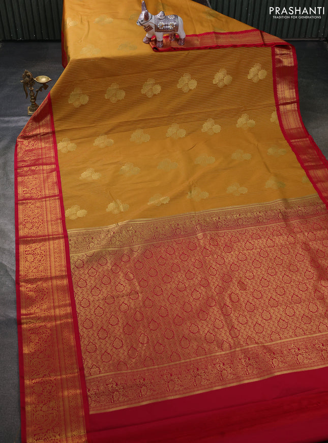 Semi kanchipuram silk saree mustard yellow and pink with allover zari weaves & buttas and zari woven border