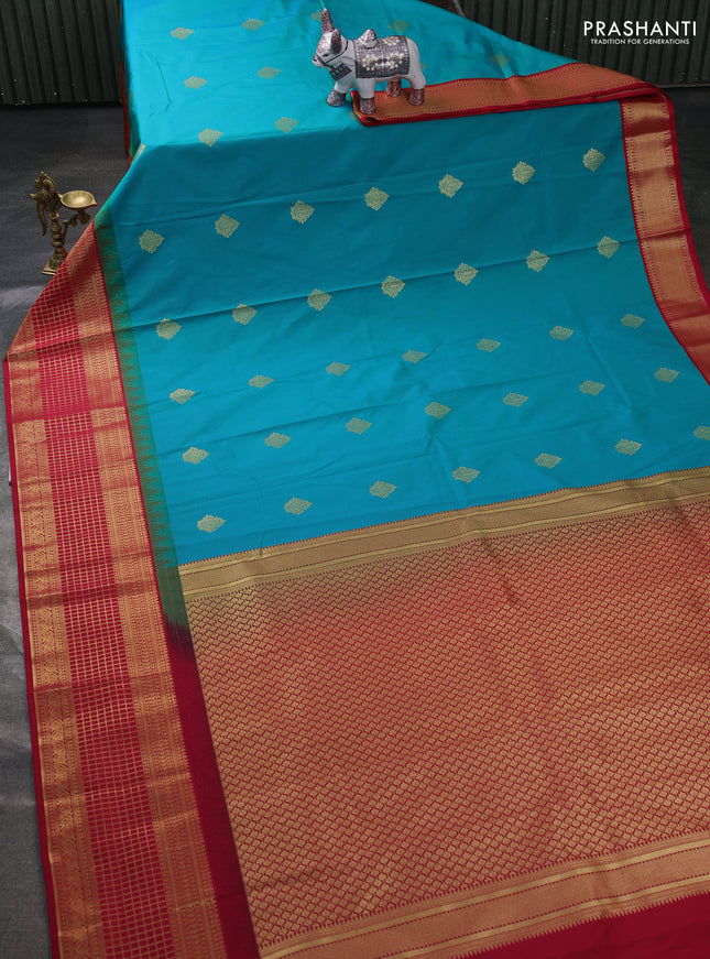 Semi kanchipuram silk saree dual shade of teal green and maroon with zari woven buttas and temple design zari woven border